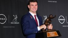 Who has won the Heisman and a championship in one season?