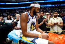 Moses Moody injures knee late in Warriors' OT win at Dallas