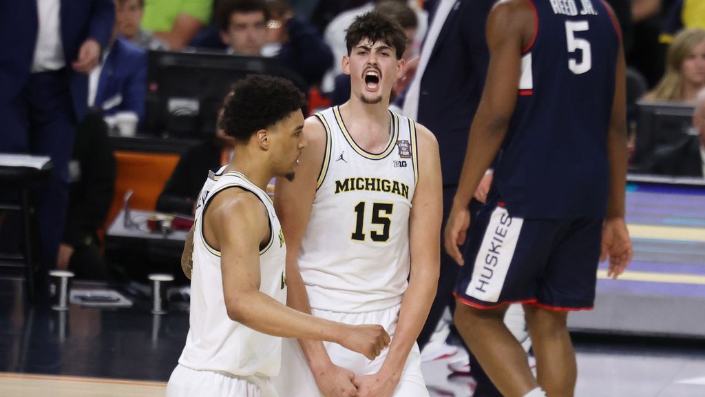 Michigan holds off UConn to win second hoops title