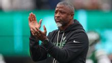 HOFer Ronnie Lott offers words of encouragement to Aaron Glenn as losses pile up