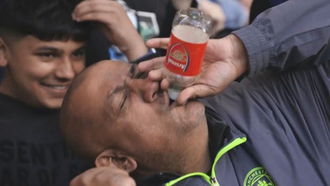 Manchester City fans celebrating in the away end