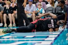 Heat's Bam Adebayo limps off after tumble with LaMelo Ball