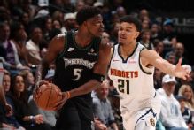 Wolves' Edwards helped off court with apparent left knee injury