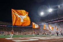 Texas bans fan who made obscene gesture at Florida players