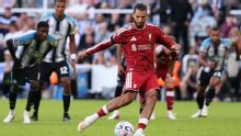 Liverpool's Dominik Szoboszlai scores late penalty to draw at Newcastle