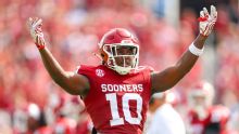 Sooners' Kip Lewis exits with apparent right knee injury