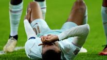 Mbappé limps off with knee injury after scoring in Zidane's France debut