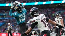 Travis Hunter stars in Jaguars' loss, is 1st with INT and TD catch since 2002