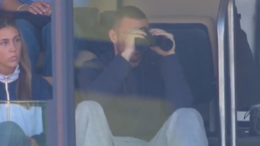 CJ Carr watches brother Tommy's first Michigan start from Big House