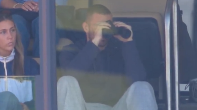 CJ Carr watches his brother Tommy at Michigan Stadium in Ann Arbor.