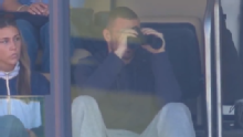CJ Carr watches brother Tommy's first Michigan start from Big House