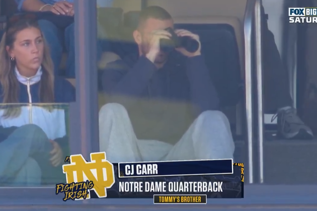 CJ Carr watches brother Tommy's first Michigan start from Big House