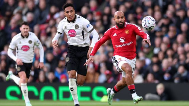 Bryan Mbeumo of Manchester United runs with the ball under pressure from James Hill of Bournemout