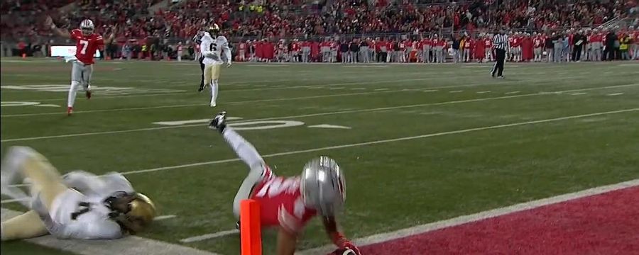 Chris Olave dives for the pylon to keep Ohio State rolling