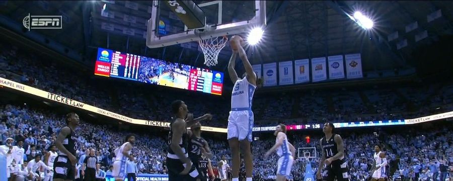Armando Bacot gets up from under the basket for a big jam