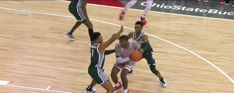 E.J. Liddell shoots over defenders to sink the tough and-1 bucket