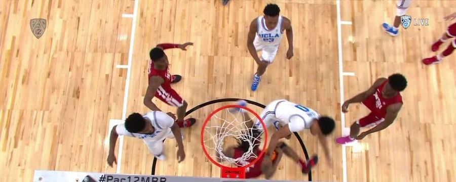 Efe Abogidi stuffs UCLA with the denial at the rim
