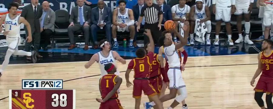 Peyton Watson weaves through traffic for the tough bucket