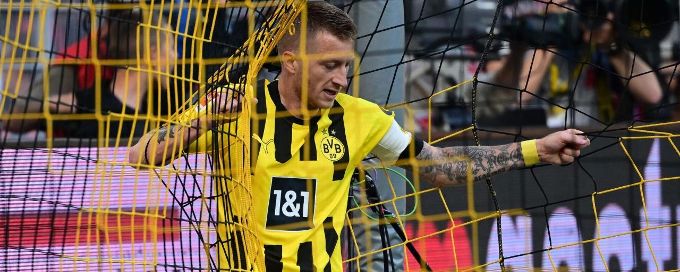 Marco Reus taps in Dortmund's opener on the goal line