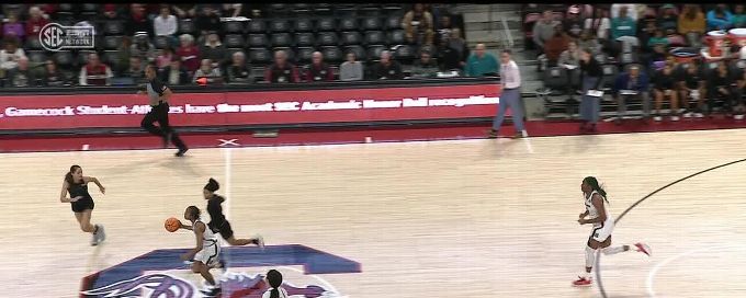 Zia Cooke sinks a 3-pointer