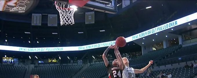 Rusne Augustinaite rises to block the shot