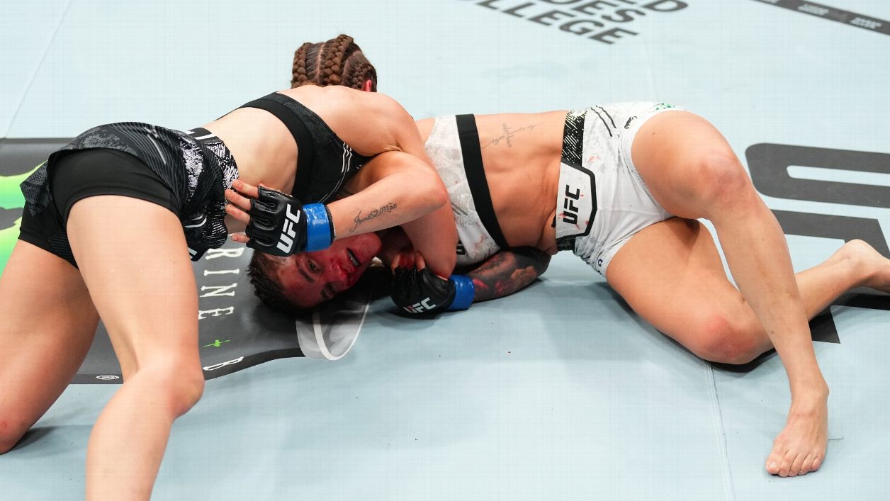 Jasmine Jasudavicius landing a punch against Jessica Andrade