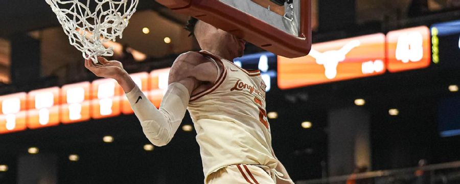 Texas' Chendall Weaver hits his head on backboard while dunking