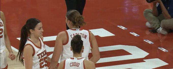 Justice Carlton rises to block the shot