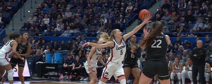 Paige Bueckers makes a wild steal leading to fast-break layup