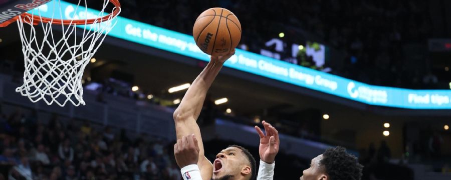 Giannis slices through the lane for a jam