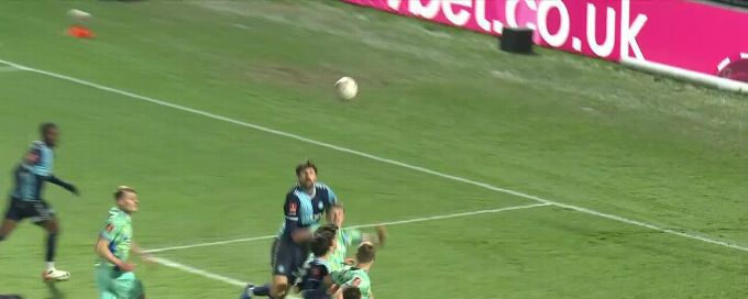 Sonny Bradley slots in the goal for Wycombe Wanderers