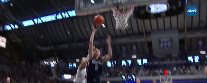 Paige Bueckers fininshes through contact