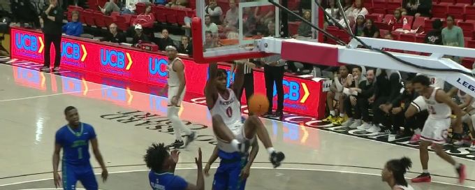 Mekhi Collins gets up for the beautiful slam dunk