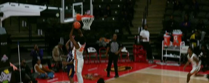 Ja'Derryus Eatmon gets the hoop and the harm