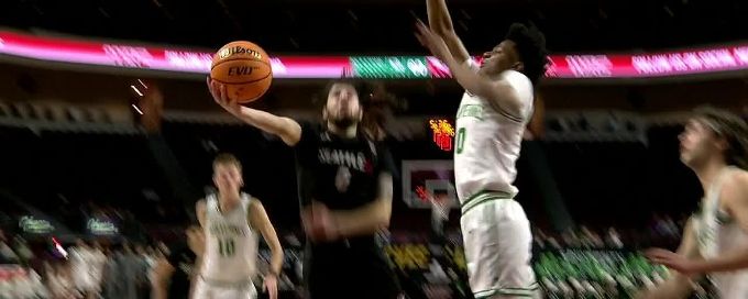 Dominick Nelson with the massive block at the rim