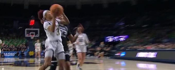 Hannah Hidalgo finishes through contact for Notre Dame
