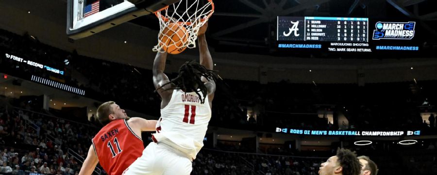 Alabama's Clifford Omoruyi slams home a reverse alley-oop