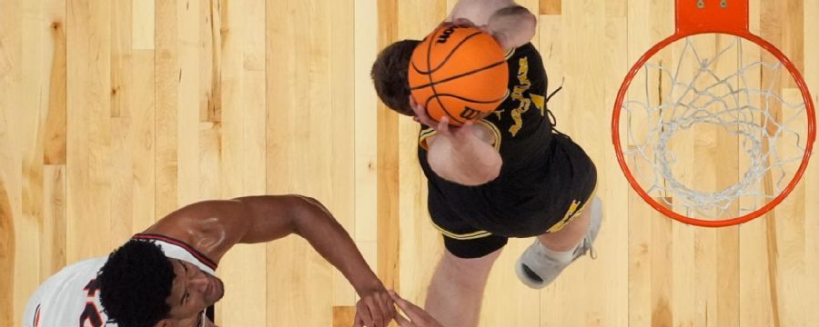 Danny Wolf rises for Michigan slam