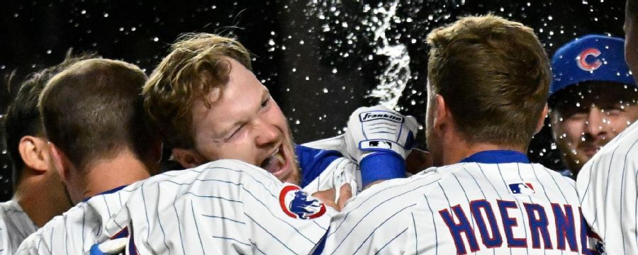 Wrigley goes wild as Ian Happ wins it in extras for Cubs