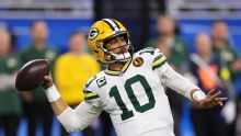 Love matches career high with 4 TD passes, lifting Packers to 31-24 win over Lions