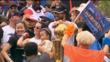 Jalen Brunson and family show off Finals trophy on parade float