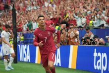 Ronaldo responds with double and World Cup record