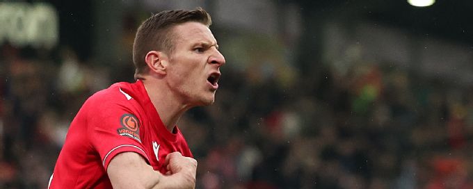 Paul Mullin's second-half brace leads Wrexham to win and promotion