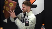 Sam Darnold given a fake ham hat during his news conference