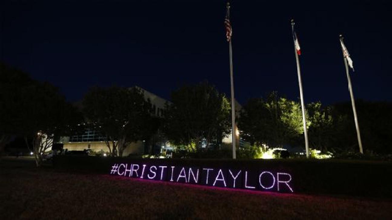 A sign with Taylor's name in lights was displayed during a demonstration Monday outside the Arlington Police Station.