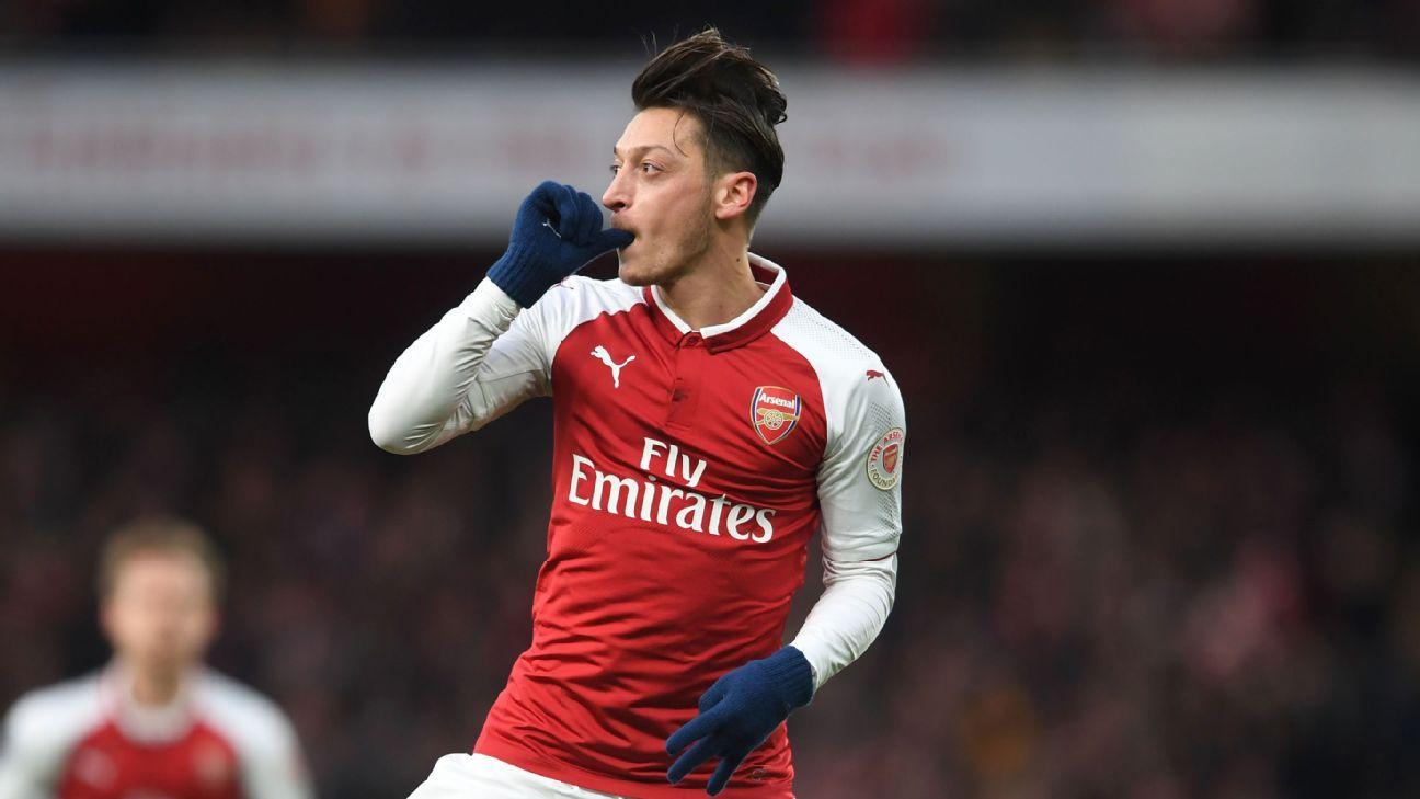 Mesut Ozil celebrates after scoring for Arsenal against Newcastle.