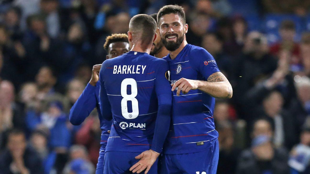 Olivier Giroud, right, celebrates with Chelsea teammates after scoring a goal against PAOK in the Europa League.
