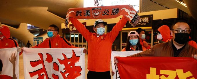 Wuhan football team return after four months locked out of city
