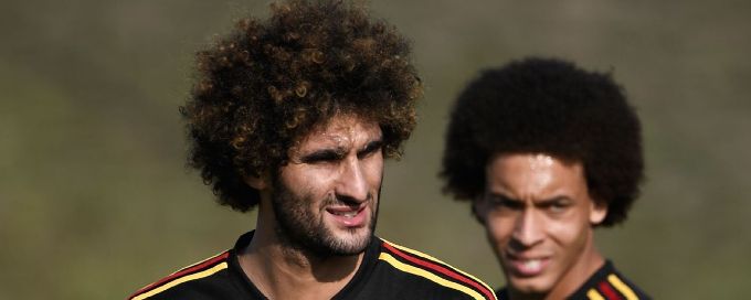 Fellaini, Witsel help save Belgian club Standard Liege from expulsion