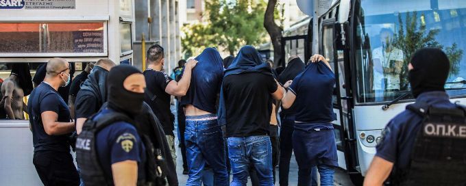 Greek court orders 105 charged in soccer riot to stay in jail